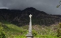 
(20a) War memorials are always thought-provoking places:  here you see many names from a community that is small and so remote - remoteness that didn't confer safety.  This memorial at Fasag (Torridon village), has one of the most dramatic backgrounds: Mullach an Rathain.
	