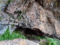 
(20b) Church Cave, South Rona:  this Island is to the west of the Outer Loch.  There are many caves in the west Highlands that have been used as churches.  Although Rona's wardens are the island's only inhabitants, this rough place was used for a wedding a few months before we saw it:  reached only over steep rocky ground and a long walk from the nearest anchorage - it is another poignant place.
	