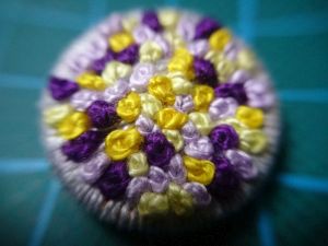 Floral wreath button