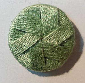 Thread wrapped buttons