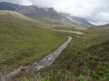 
	Looking back to Lochan an Iasgair and the Ling Hut,
	with Beinn Eighe behind
	