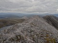 
	Looking along the summit ridge of Beinn Liath Mhor, from the
	summit.  To the right it descends to Coire Lair.  Beinn Liath
	Beag is the light-coloured hill to the left of the ridge.

	