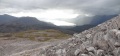 
	Showers to the west:  as yet we were not far below the summit:  
	the quartzite/sandstone divide can be clearly seen lower left
	