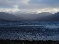 Looking towards the head of the loch, (left to right, with snow) Sgorr Dubh, Beinn Liath Mhor, Sgurr Ruadh were all out of cloud, and there's some sunshine over there, silhouetting Meall Dearg (right).  But the wind wasn't abating.