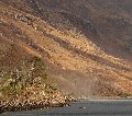 Spray whipped up from the surface of the loch