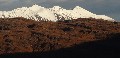 Contrasts started early, though they became stronger:  The skyline is Beinn Eighe's Spidean Coire nan Clach (left) and Sgùrr Ban (centre), snow-covered quartzite territory; low sun picks out Seana Mheallan's very different (Torridonian) structure in the foreground.