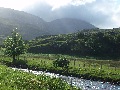 A similar view in the morning, with cloud clearing from
		Conival