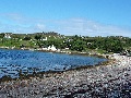 Inverkirkaig bay, looking across to the north side.
		Unst chalet, where we stayed (dark wooden clad building), is
		visible in the centre.